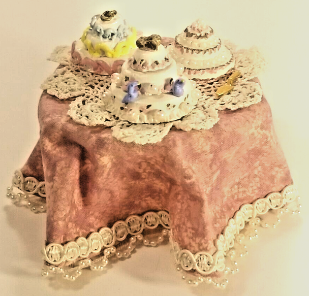 RESALE SHOP - 1:12 Dollhouse Table With Frilly Pink Table Cloth And Handmade Cakes - preowned