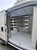 84"L x 62"H 4-Shelf Shelving Unit Side Door view in a promaster