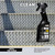 A black bottle of Flitz Metal Preclean next to stainless steel stairs.