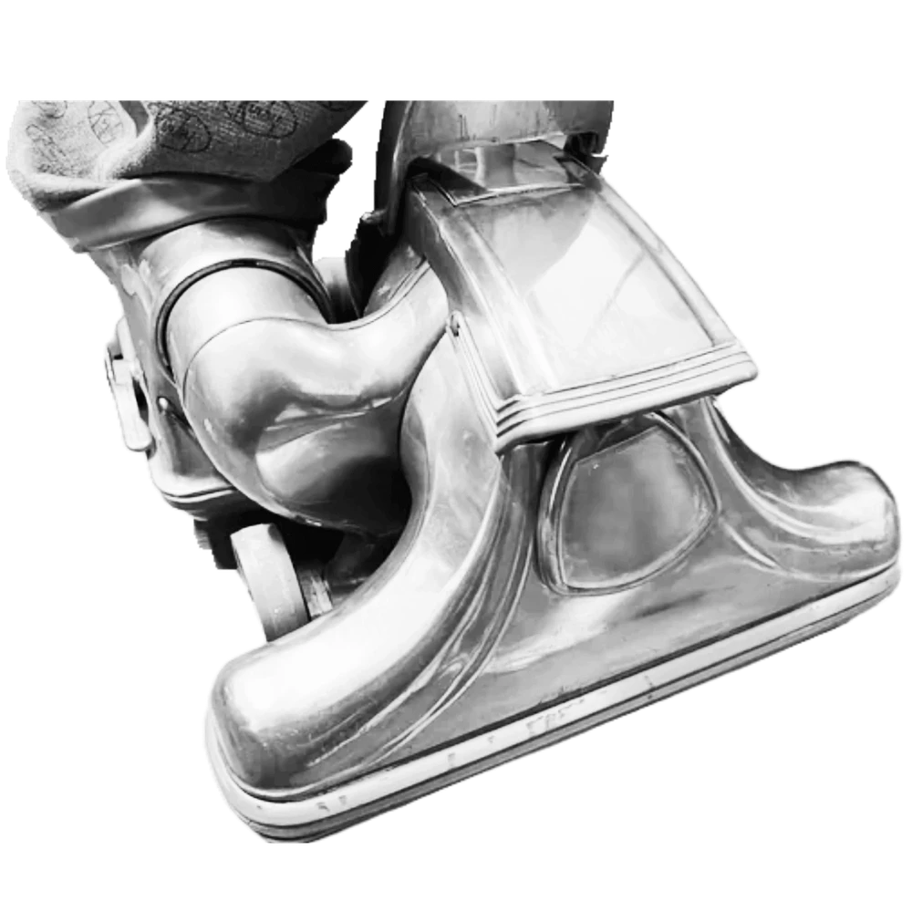 Polished metal vacuum representing the origins of Flitz