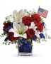 Mix of alostromeria, lilies, carnations and filler in red, white, blue theme. Standard