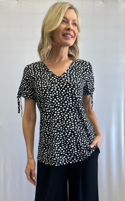 Front of the Polka-Dot Tie Sleeve Top style 202290 from Soft Works in the colors black and white