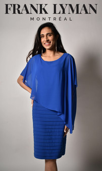 Model wearing the Chiffon Overlay Cocktail Dress from Frank Lyman in the color royal blue