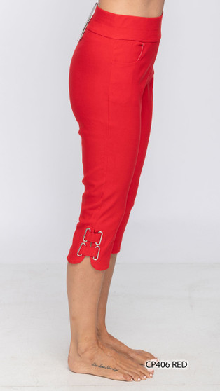 Model wearing the Buckle Capri Pants from Fashion Cage in the color red