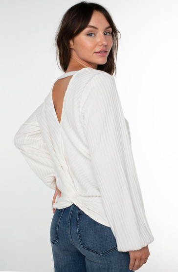 Model wearing the Twist Back Knit Top from Liverpool in the color cream