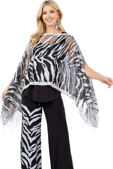Front of the 7-Way Zebra Print Shawl worn as a poncho from Kokomo in the colors black and gray