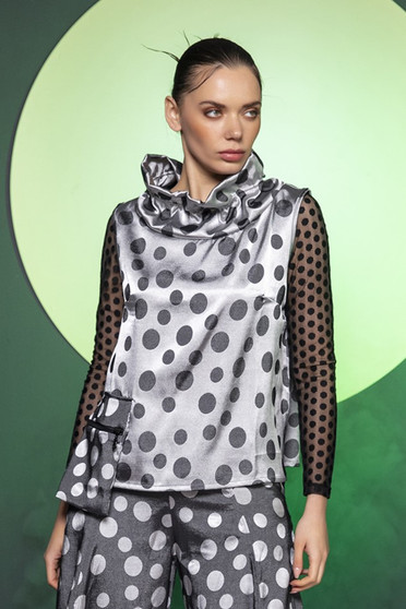 Model wearing the Aris Polka-Dot Pocket Vest from Kozan in the Pleats print
