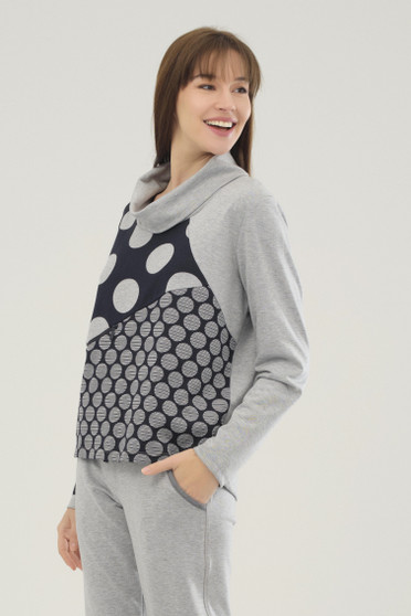 Model wearing the Polka Dot Cowl Top from Ever Sassy in the colors navy and gray