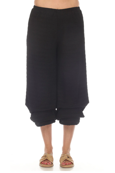 Front of the Cropped Waffle Knit Pants from Inoah in the color black