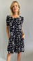 Front of the A-Line Polka Dot Dress from Soft Works in the colors navy and white