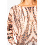 Close up of the Zebra Symmetry Print Sweater from Look Mode in the color rust