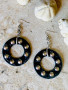 Front of the Jett Black Small Studded Hoops from Water and Wave