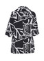 Back of the Hepburn Graphic Print Button-Up Jacket from Kozan in the colors black and white