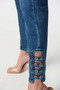 Close up of the Embellished Eyelet Slim Fit Jeans from Joseph Ribkoff in the color medium blue