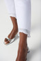 Close up of the Embellished Frayed Hem Cropped Jeans from Joseph Ribkoff in the color white