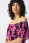 Close up of the Floral Print Chiffon Off-Shoulder Pleated Dress from Joseph Ribkoff in the colors black and pink