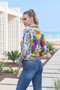 Model showing the back of the Botanica Jean Jacket from Dolcezza in the multicolor print