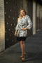 Front of the Polka-Dot Petal Hem Coat Dress from Samuel Dong in the colors white and black