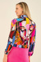 Model wearing the Baisti Print Face Jean Jacket style 75627 from Dolcezza in the multicolor print