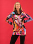 Model wearing the Baisti Print Drawstring Tunic style 75624 from Dolcezza in the multicolor print
