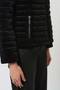Close up of the Stretch Velvet Puffer Jacket with Faux Fur Collar style 253928 from Joseph Ribkoff in the color black