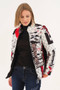Model wearing the Bookworm Print Quilted Jacket style 75831 from Dolcezza in the multicolor print