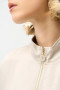 Close up of the Satin Boxy Blouson Jacket With Drawstring Hem style 261913 from Joseph Ribkoff in the color moonstone