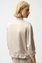 Back of the Satin Boxy Blouson Jacket With Drawstring Hem style 261913 from Joseph Ribkoff in the color moonstone