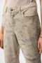 Close up of the Metallic Abstract Print Slim Crop Jeans style 261959 from Joseph Ribkoff in the colors taupe and gold