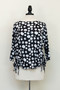 Front of the Polka-Dot Blouse with Side Ties style 771 from Vine Street in the colors black and white