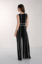Back of the Contrast Piping Belted Jumpsuit style 261005 from Frank Lyman in the colors black and off white