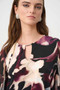 Close up of the Silky Knit And Chiffon Abstract Print Top With Rhinestone Trim style 263757 from Joseph Ribkoff in the black/multi print