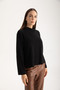 Side of the Benji Funnel Neck Top style 421-13135 from Isle in the color black
