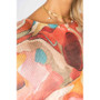 Close up of the Abstract Print Batwing Sweater style 0935 from Look Mode in the color red
