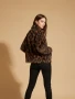 Back of the Leopard Pattern Winter Jacket style IN418 1957 from Nikky Apparels in the black/brown print