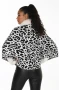 Back of the Fur Trim Animal Print Knit Cape style 263806 from Frank Lyman in the colors cream and black