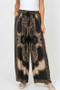 Front of the Detailed Printed Satin Pants style 64074 from Look Mode in the color black