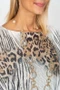 Close up of the Chain Animal Print Batwing Sweater style 0410LS from Look Mode in the color black