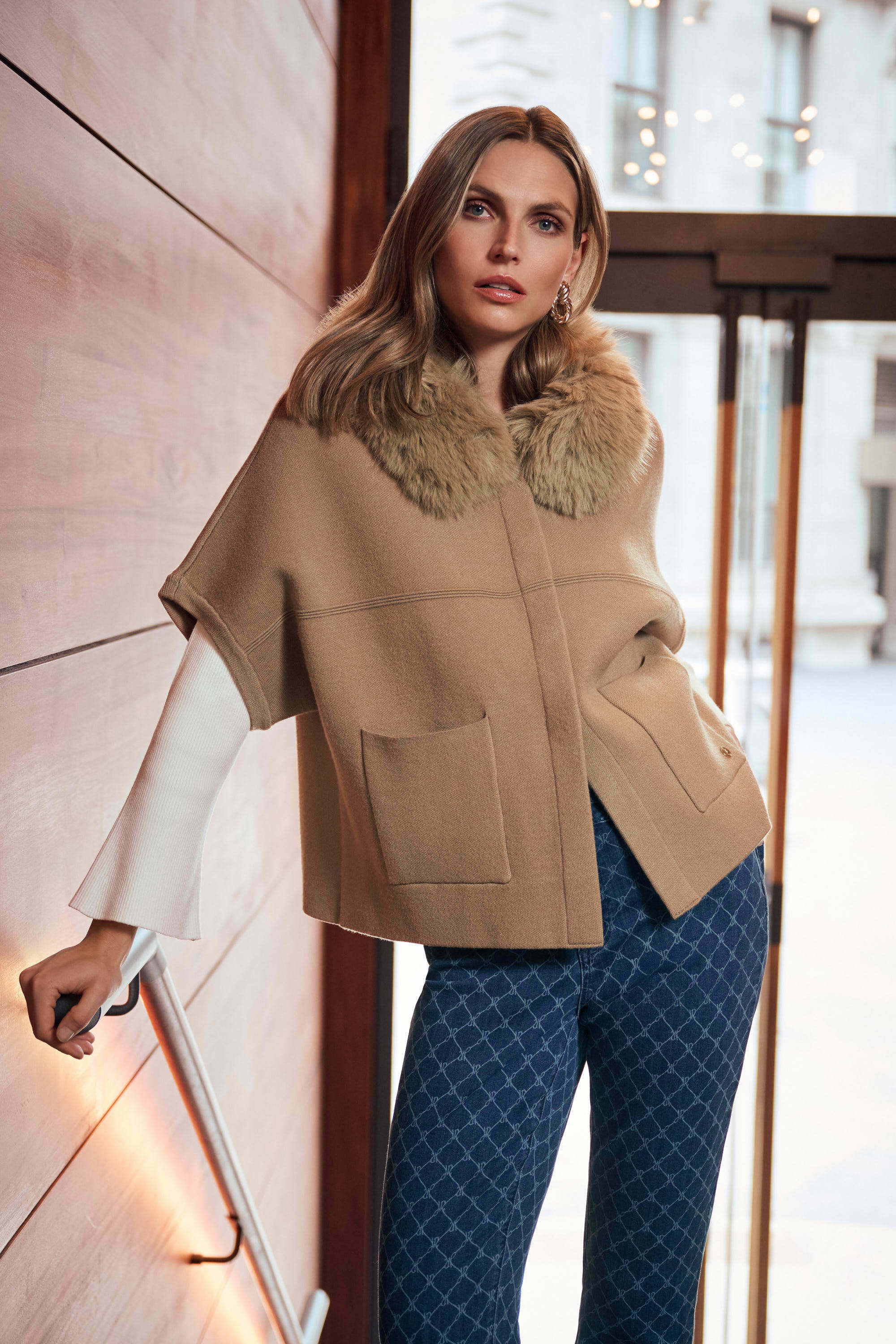 Model wearing the Sweater Knit Jacket With Detachable Faux Fur Collar from Joseph Ribkoff
