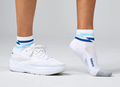A Feetures Elite Light Cushion QTR White Track