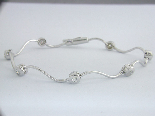 Custom design wavy bar links and bezel set diamond bracelet