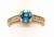 Round blue topaz and diamond ring