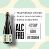 Kolonne Null Cuvée N°01 Sparkling poured in a wine glass at a fine-dining table — alcohol-free sparkling wine
