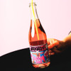 BonBon Sparkling Rose Non-Alcoholic Wine Held with Pink Background