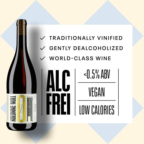 Kolonne Null Cuvée N°02 Rouge poured in a wine glass at a fine-dining table — alcohol-free still red wine