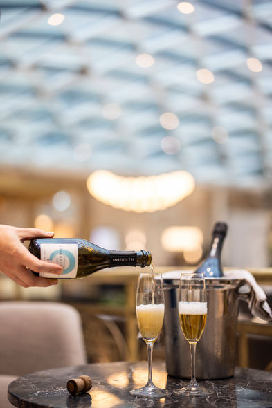Copenhagen Sparkling Tea BLÅ chilled in a champagne glass at a fine-dining restaurant — alcohol-free