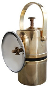 Safe, simple and durable design of solid brass.
Water in the top chamber drips onto carbide fuel in the lower chamber which produces acetylene gas. A small amount of pressure builds up to push gas through the orifice in the 4-1/4"OD chrome reflector.
Brightness is controlled with a valve that regulates how fast the water drips from upper to lower chamber.
Light with flint striker on reflector. Safe, simple and durable design of solid brass.
Water in the top chamber drips onto carbide fuel in the lower chamber which produces acetylene gas. A small amount of pressure builds up to push gas through the orifice in the 4-1/4"OD chrome reflector.
Brightness is controlled with a valve that regulates how fast the water drips from upper to lower chamber.
Light with flint striker on reflector.