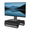 Fellowes Monitor Stand for Desk, a black, ergonomic portable monitor stand with three height settings placed on a black adjustable base, supporting a large flat-screen monitor displaying a scenic mountain landscape and lake.