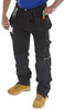 SHAWBURY MULTI PURPOSE TROUSER BLACK 46T, image showing a person wearing black multi-purpose trousers suitable for work or outdoor activities, paired with tan shoes.