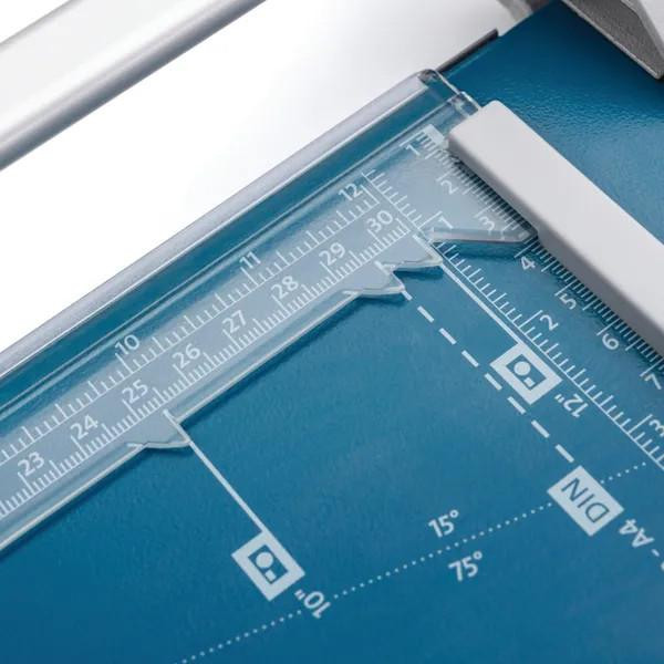 Dahle 507 A4 Self-Sharpening Paper Trimmer Guillotine with Safety Cutting Protection, Blue, showing the clear acrylic ruler and cutting guide on the blue cutting surface.